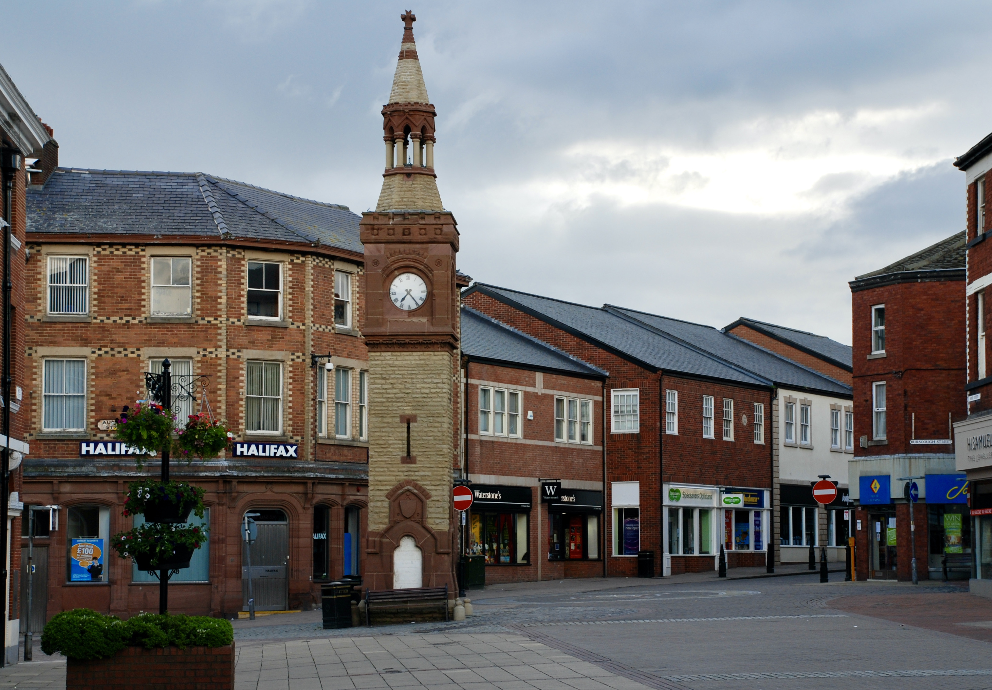 The clock tower at the heart of Ormskirk town centre, surrounded by shops